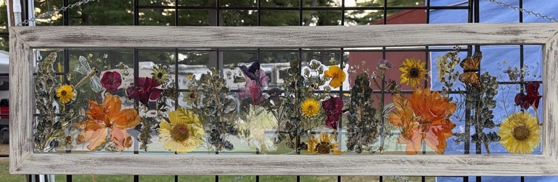 Handmade dimensional frame with layered wildflowers, sunflowers, and a monarch butterfly by Snowbird Creations
