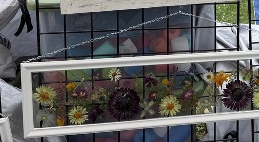 Framed dimensional piece with a lily, sunflowers, and a monarch butterfly